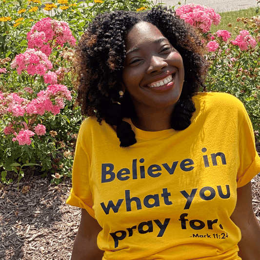 Black African American model wearing Yellow Belive in what you pray for at Veterans Memorial Park